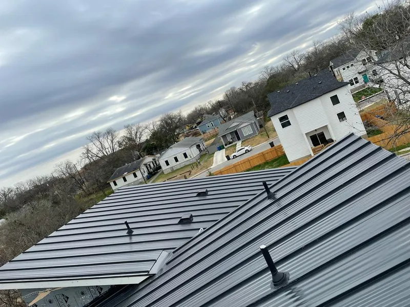 Standing seam metal roof panels with vents for Skylight Repair in Rochester Hills